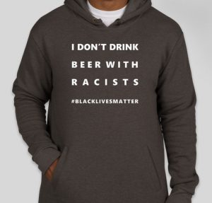 Fundraiser hoodie in black with the text "I don't drink beer with racists."